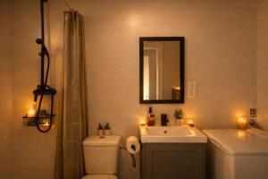 a bathroom with a toilet and a sink and a mirror at Apartament a Sant Celoni, Montseny, Barcelona in Sant Celoni +15 photos
