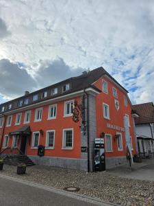a large orange building on the side of a street at Brauerei Walter in Waldshut-Tiengen