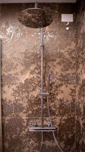 a glass shower in a bathroom with a wall at Ca' Perenzin in Tarzo +38 photos