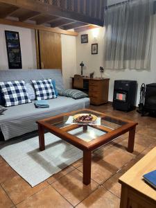 a living room with a couch and a coffee table at Casas Del Monte II in Valverde
