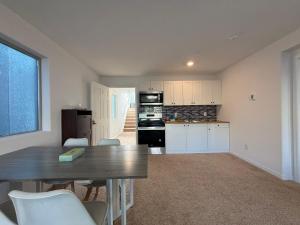 a kitchen and dining room with a table and chairs at Vegas courtyard B&B 拉斯小院儿民宿 in Las Vegas