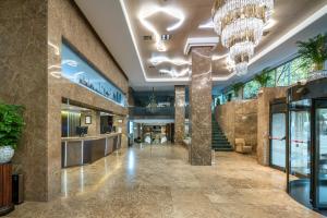 a lobby of a building with a chandelier at Agumar Atocha in Madrid
