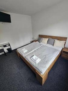 a bedroom with a large bed in a room at Vlčí důl Bludov in Bludov