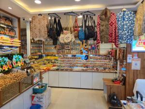 a store filled with lots of bags and purses at Hotel Maha Luxmi Palace in Katra