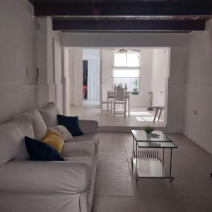 a living room with a couch and a table at La Ñata Apart in Junín