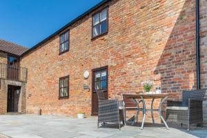 a brick building with a table and chairs at 2 Bed in Thwing oc-t29012 in Thwing