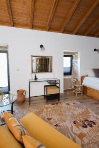 a living room with a couch and a table at Casa do Cancelo in Mondim de Basto