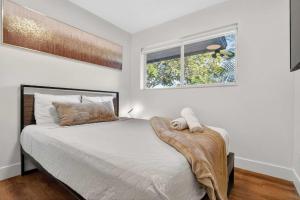 a bedroom with a bed with a blanket on it at Home at Boulevard Heights, Hollywood in Hollywood +25 photos