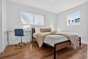 a bedroom with a bed and a desk and a chair at Home at Boulevard Heights, Hollywood in Hollywood