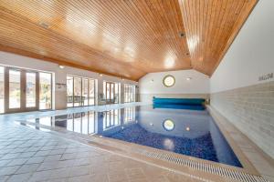 a swimming pool in a house with a ceiling at 3 Bed in Thwing oc-t29011 in Thwing