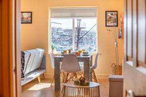 a dining room with a table and chairs and a window at 2 Bed in Whitby oc-h31801 in Whitby