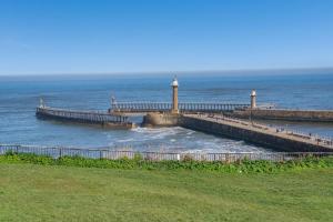 a pier in the water next to the ocean at 2 Bed in Whitby oc-h31801 in Whitby