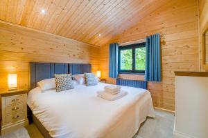 a bedroom with a large bed in a wooden room at 2 Bed in Nafferton oc-o31954 in Nafferton