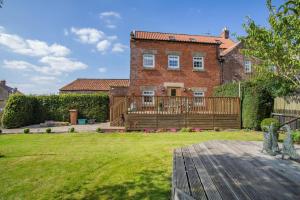 a large brick house with a large yard at 2 Bed in Pickering oc-t29975 in Middleton