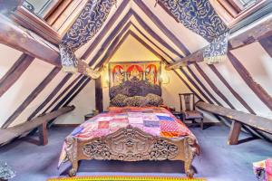 a bedroom with a king sized bed in a attic at 1 Bed in Long Bennington oc-t29871 in Long Bennington