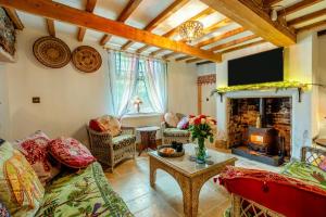 a living room with a couch and a fireplace at 4 Bed in Long Bennington oc-p29872 in Long Bennington