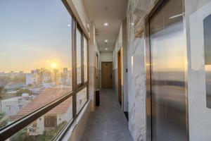 a hallway of a building with a view of a city at An Thy HOTEL in Vung Tau