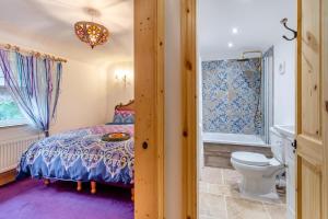 a bedroom with a bed and a toilet at 4 Bed in Long Bennington oc-p29872 in Long Bennington +25 photos