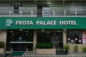 a frida palace hotel sign in front of a building at Frota Palace Hotel in Macapá