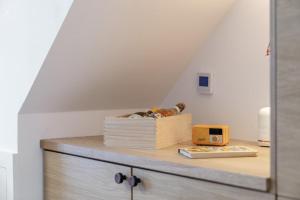 a wooden cabinet with a box on top of it at 2 Bed in Helmsley oc-p36613 in Helmsley +20 photos