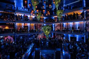 a crowd of people at a bar in a building at The Liberty, a Luxury Collection Hotel, Boston in Boston