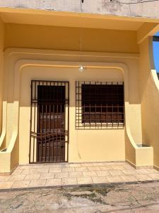 an entrance to a building with two iron gates at Apartamento Barbosa in Santarém
