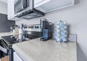 a kitchen with a sink and a stove top oven at Red Bud in Chattanooga +20 photos