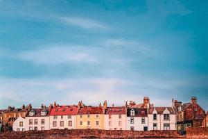 a large white building with red roofs at Calabeinn in Anstruther