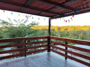a balcony with a view of the forest at Casa tierno amanecer in Xpujil