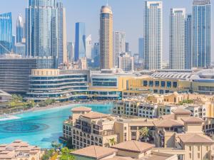 an aerial view of a city with tall buildings at the 'New York' Condo - 4BR Executive Burj Khalifa Suite in Dubai