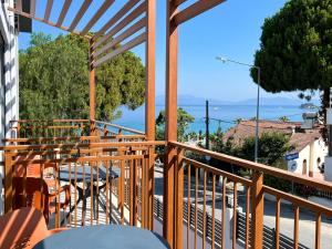 a balcony with a table and a view of the ocean at MY Sunset Suite in Kuşadası