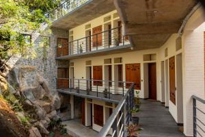an external view of a building with a balcony at DrUnni's Ayurveda Resort in Kovalam