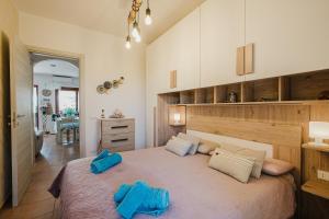 a bedroom with a large bed with two pillows on it at villetta giulia fronte mare in Stintino +172 photos
