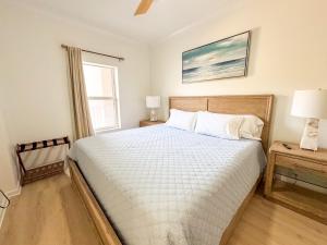 a bedroom with a large bed and a window at Destin Harbor Escape in Destin