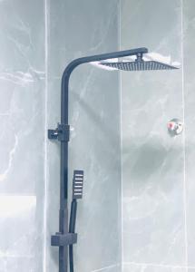 a street light in a shower with white tiles at Rooms & Suites Western Dhafra Housing in Ghayathi