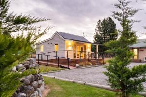 a home with a large deck and a house at The Dales in Twizel