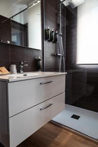 a bathroom with a white sink and a shower at D'Stay in Bari +75 photos