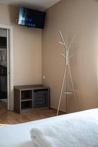 a room with a windmill and a tv on the wall at D'Stay in Bari