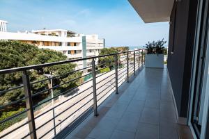 a balcony of a building with a view of the ocean at D'Stay in Bari