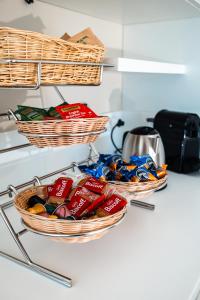 two baskets on a counter with snacks in them at D'Stay in Bari