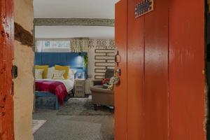 a bedroom with a bed and a couch in it at One Drake Road Hotel in Tavistock +48 photos