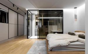 a bedroom with a large bed and a bathroom at Superb 2 Bed Apartment in George Town