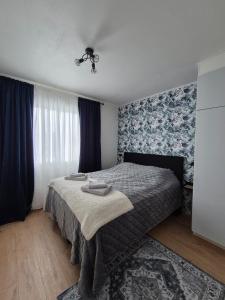 a bedroom with a bed with blue and white walls at Azure Nordic Retreat in Rauma