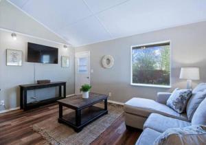 a living room with a couch and a table at Pawnee 2 - Newly Renovated Duplex in Chattanooga
