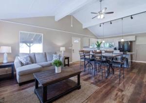 a living room with a couch and a table at Pawnee 2 - Newly Renovated Duplex in Chattanooga