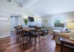 a dining room and living room with a table and chairs at Pawnee 2 - Newly Renovated Duplex in Chattanooga