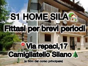 a advertisement for a house in a foreign country at S1 Home Sila in Camigliatello Silano