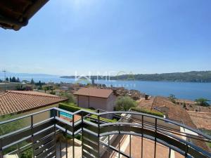 a view of the water from the balcony of a house at Apartment 4 in Salò