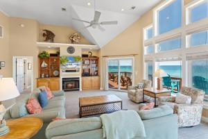 a living room with a couch and a table at 8045 - Mirlo Hi in Rodanthe