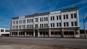 a white building on the corner of a street at The St Nicholas Hotel in Albany